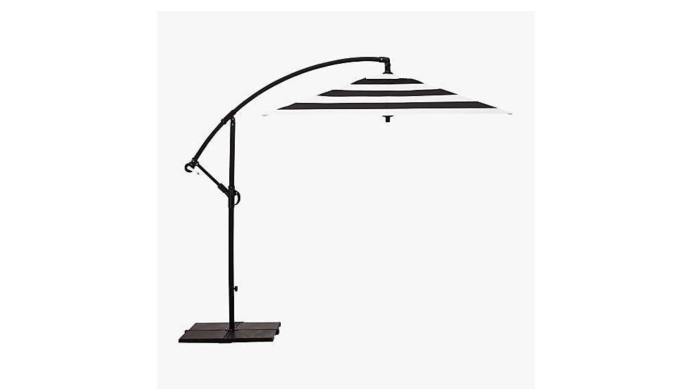 black and white striped umbrella with base