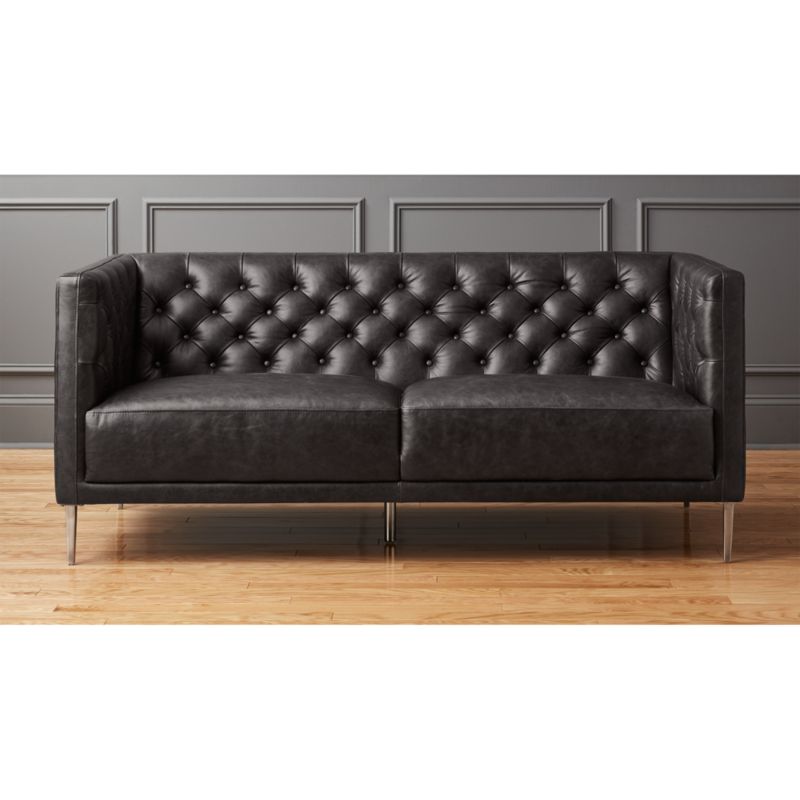 black leather tufted sofa