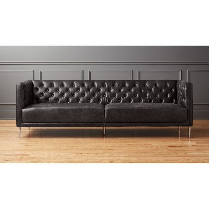 black faux leather tufted sofa