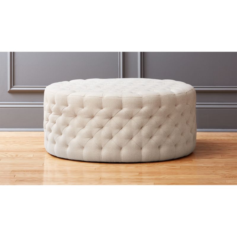natural round tufted ottoman CB2